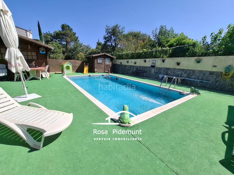 Foto 4e0d4c63-bf94-4a60-aaf3-79e6cf336d19. Casa con camino parcheggio piscina in Aiguaviva Parc Vidreres