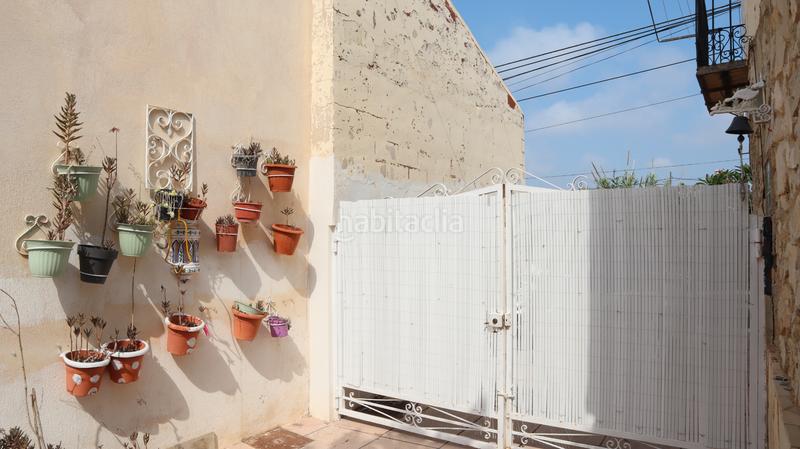 Foto f28d76ea-c5bd-4cb7-a556-4197bba44521. Casa adossada amb xemeneia a El Secanet-Hacienda del Sol Vila Joiosa (la)