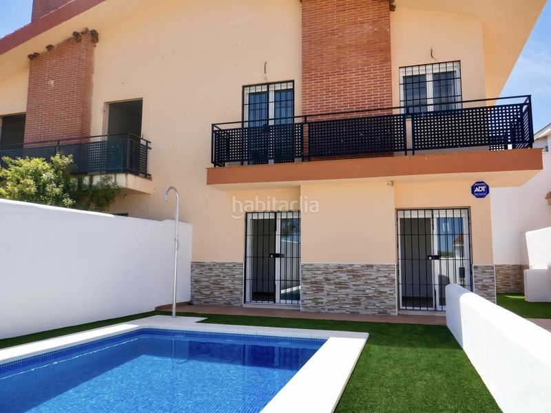 Foto 858171ce-3588-47d4-9284-01abe090ff7f. Casa aparellada amb aparcament piscina a Ronquillo (El)