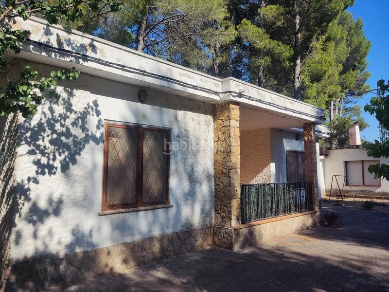 Foto fe435cf7-38b4-4a83-8f75-910a92937a02. Chalet with fireplace parking in Sénia (La)