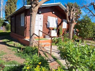 Casa a Llano de Brujas. Casa de madera con parcela en la huerta de llano de brujas