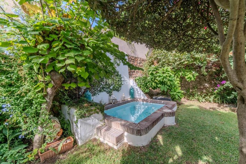 Foto d75de817-a43b-464e-8bab-379dd430f54b. House with parking in Montemar Torremolinos