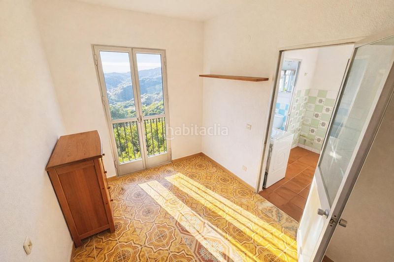 Foto 24bba459-9d00-486e-93fd-41d4c8ea0348. Casa amb aparcament a Frigiliana