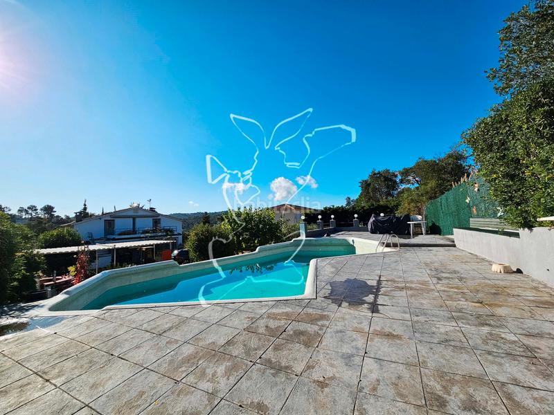 Foto 4c1a3cac-7848-4cc3-abab-540b52b63341. Chalet avec cheminée parking piscine dans Aiguaviva Parc Vidreres