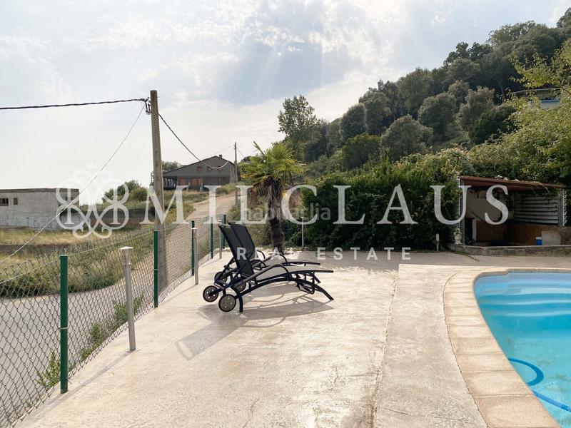 Foto 8656b969-8c9c-425f-bf80-e1e9e3669f1b. Casa amb xemeneia calefacció aparcament piscina a Sant Iscle de Vallalta