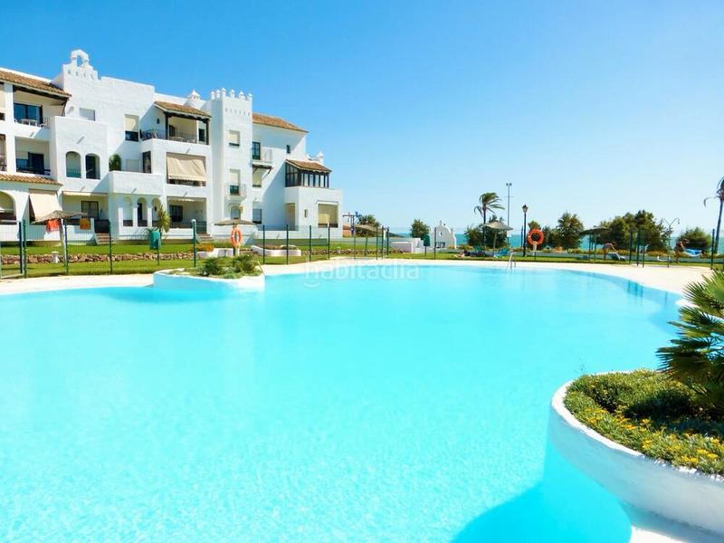 Foto 0253e83c-faf1-47b9-be54-f85ba6361c32. Chalet avec chauffage parking piscine dans La Barrosa Chiclana de la Frontera