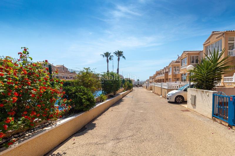 Foto 7660dd5b-182d-4f75-ba9b-6625a02ae1f9. Maison jumelée avec parking piscine dans Los Balcones y los Altos Orihuela