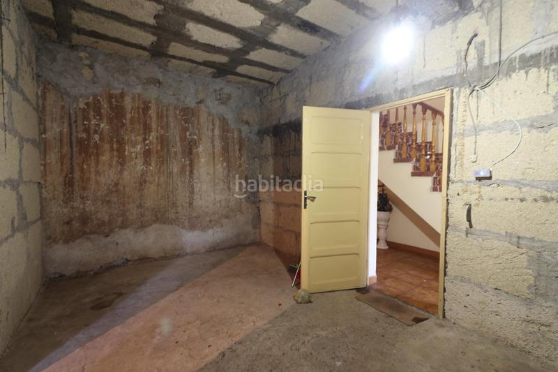 Foto fea4f9d7-a66f-4e3a-845a-4b68827d5e1c. Casa amb aparcament a Charco del Pino Granadilla de Abona