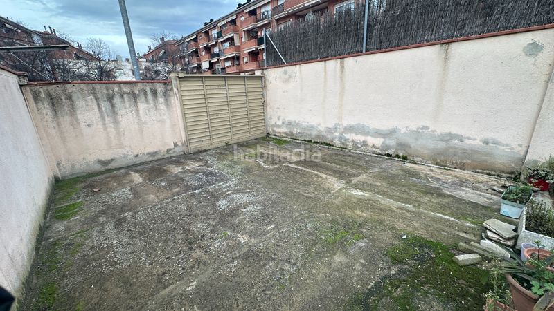 Foto c96a3a2f-a601-4827-8e2f-173bee131672. Casa aparellada amb calefacció aparcament a Centre Rubí