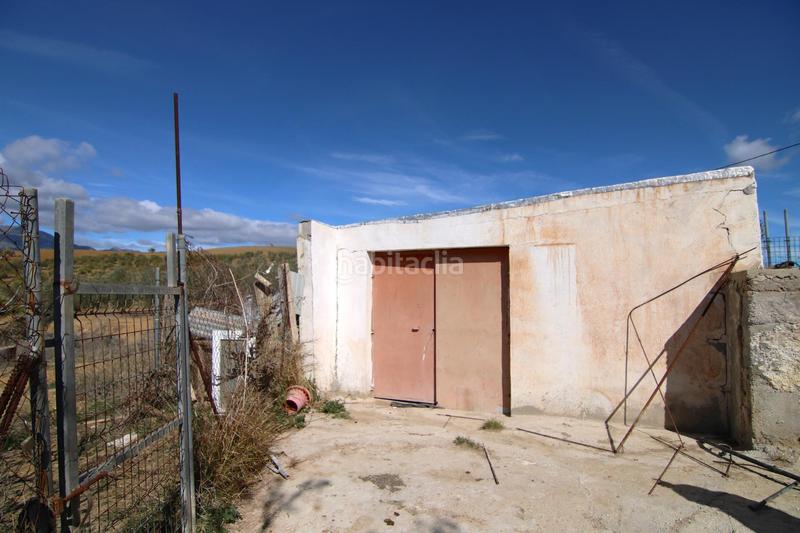 Foto 894629fb-ff85-4324-ba80-0916b0788f20. Masía parcela rural con casa, almacen y alberca. en Coín