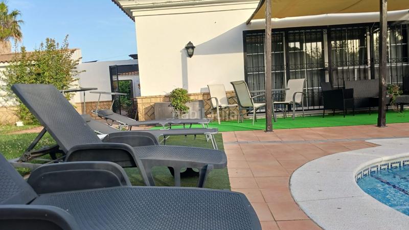 Foto d5c15d12-5eb8-4fe8-a290-51168dfa09ae. Casa exclusivo chalet con piscina privada en parcela de 780m en nuevo portil en El Portil
