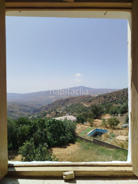 Foto 620f4733-11b5-4abb-a6b0-bfeb57c8ada8. Casa amb xemeneia a Alpujarra de la Sierra