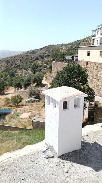 Foto d2ab79ef-32a6-4329-abc3-40d35e8762fb. Casa amb xemeneia a Alpujarra de la Sierra