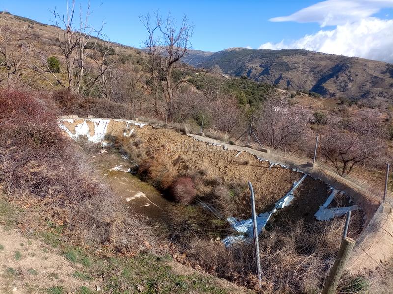 Foto 282e1add-edcf-4066-8cfc-bd434cfa11b0. Finca rústica terreno con cortijo en mecina bombaron en Alpujarra de la Sierra