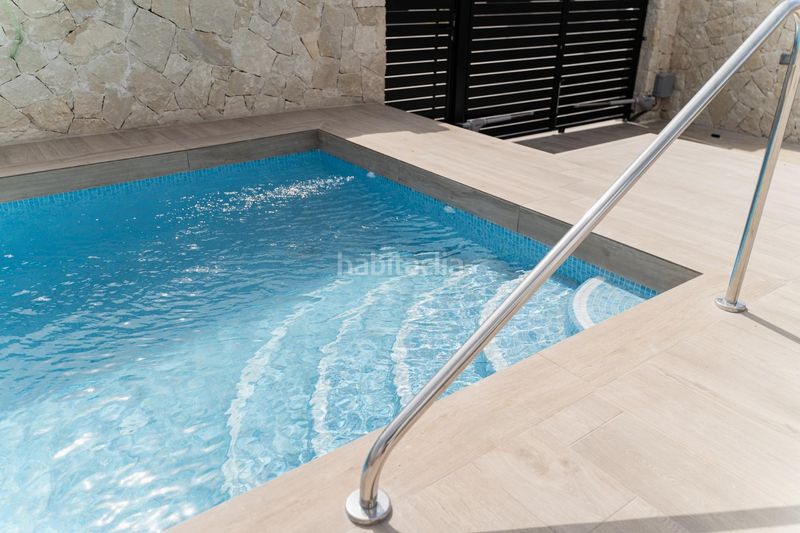 Foto c2fb54f9-55dd-40ec-bbc6-16179dee3923. Chalet complejo residencial de nueva obra en punta prima en Orihuela