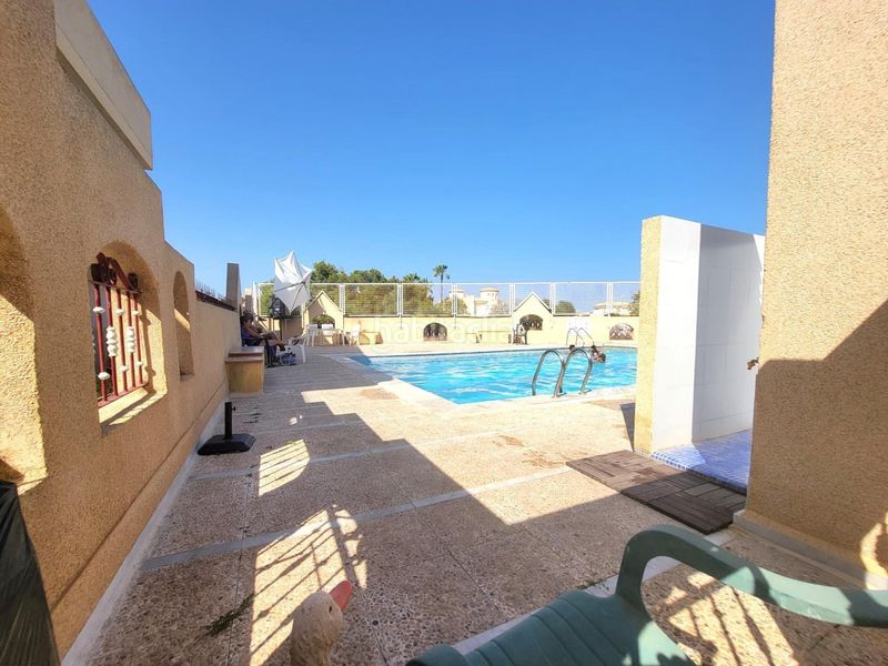 Foto 51cfb1e2-b687-4fd7-9688-977f391b717d. Casa adossada amb aparcament piscina a Playa Flamenca Orihuela
