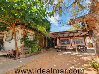 Casa a Lloret Residencial - Montlloret. Acogedora casita de obra ms un mvil home con terreno llano y v