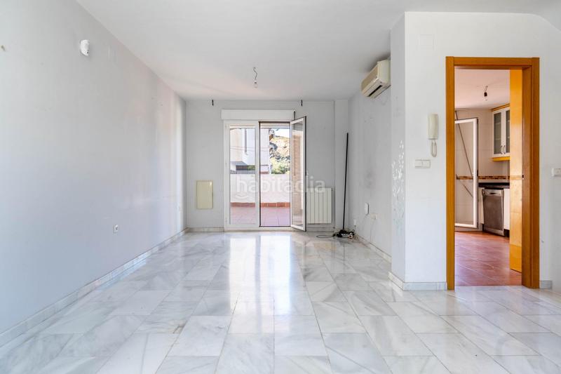 Foto 47c5f816-4476-42d4-a3a5-7cc24eb200ec. Casa aparellada amb calefacció aparcament piscina a Granada