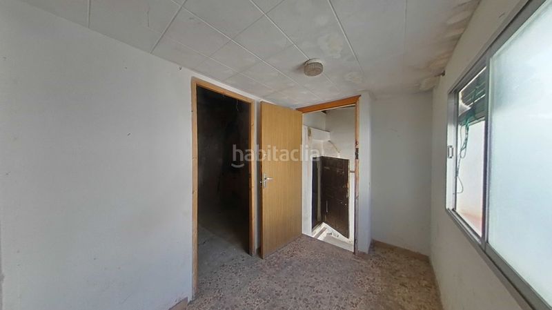 Foto f4706444-eda5-4902-bf98-c466b5adf18c. Casa adossada amb aparcament a Daimiel