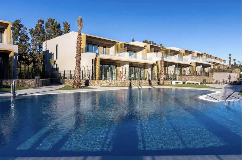 Foto 5a814918-1ecb-45bd-8e4a-e65f3f692c38. Casa a schiera con parcheggio piscina in El Faro de Calaburra - Chaparral Mijas