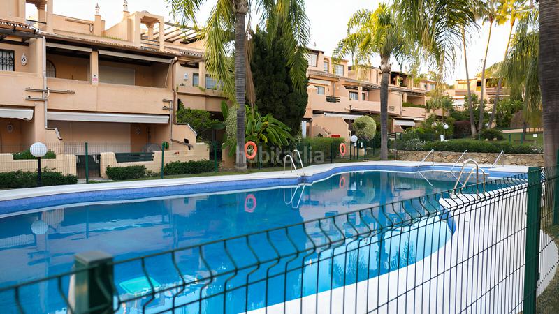 Foto 22d61628-04f6-4307-bb06-28bd8397f6a6. Reihenhaus mit parking pool in Puente Romano Marbella