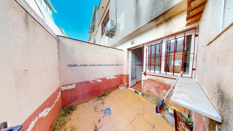 Foto 1a886dd4-6ae8-4f59-8066-f034d1c7b32e. Casa aparellada amb xemeneia aparcament piscina a Orihuela