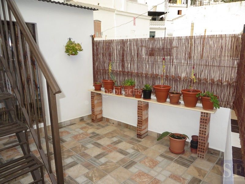 Foto fcd1bfb7-65c4-49eb-9480-4631a3a15181. Casa adossada a Cómpeta