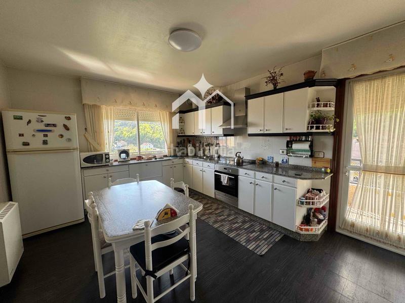 Foto f325e4c5-1afe-4b40-92cf-608a1a807061. Chalet mit heizung parking in Moaña