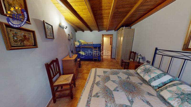 Foto 07b15f7a-ad0e-4a42-a348-81cde110582a. Casa en Enguera - parcela 140 paraje el charral 104 gran chalet rustico en montaña en Enguera
