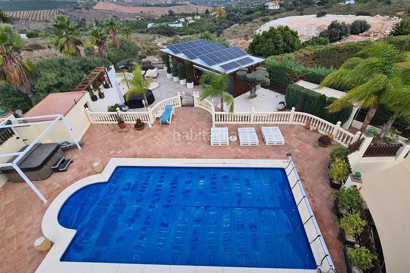 Foto a32491d9-fda4-4112-ab23-08262a19e628. Chalet mit parking pool in Coín