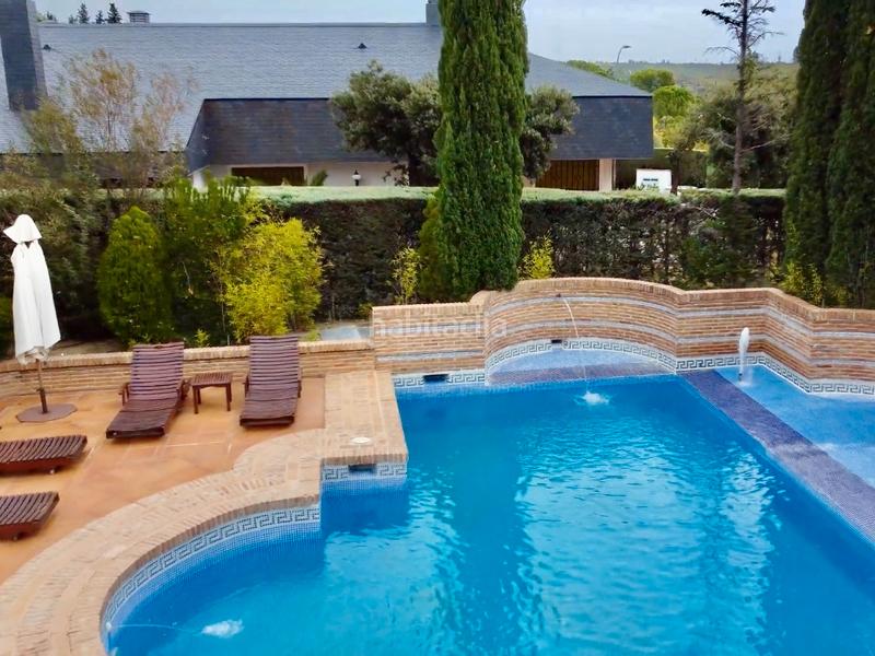Foto f1479e9b-c6dd-4423-9ded-3fcdaf2f986a. Chalet avec cheminée chauffage parking piscine dans Rozas de Madrid (Las)