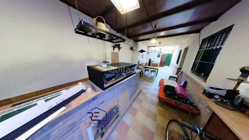 Foto c829c7c2-f6c7-419a-8e58-8a975265799e. Casa adosada en Guillena