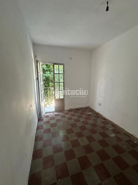 Foto 77fd53fb-d68c-42f8-9969-b6f64d4bef8f. Casa aparellada a El Cerro Sevilla