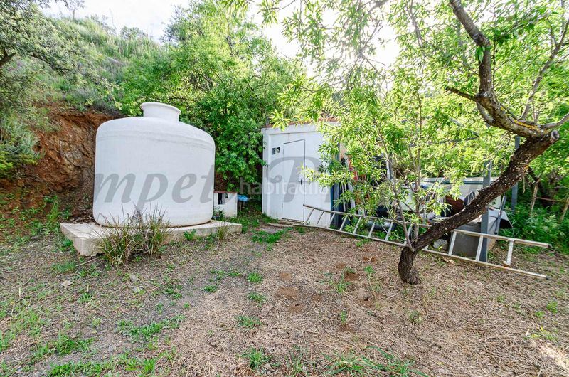 Foto 6d602c05-8978-4ddc-bfb5-513bffb10bc1. Masia amb xemeneia aparcament a Residencial Jardín Botánico Málaga