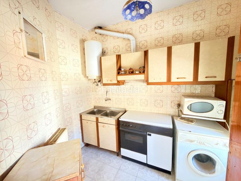 Foto bc44563f-8e80-4494-bb73-fa6449494fd6. Casa aparellada amb calefacció a Azucaica Toledo