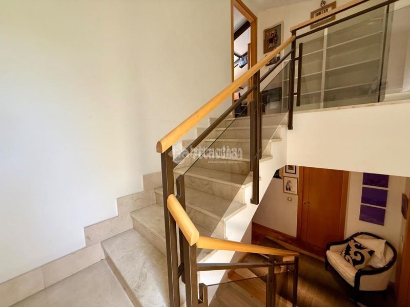 Foto 01612b2d-7f44-4369-987e-b85edda2501e. Casa aparellada amb calefacció aparcament a Villanueva de la Cañada Villanueva de la Cañada