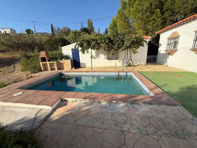 Foto a8894fe1-d632-49a6-a9a2-52645300e887. Casa con parcheggio in Fuentemora Antequera