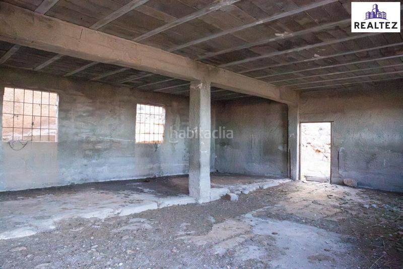 Foto b0d983a6-671c-435f-82b7-c857ed37af44. Finca rústica finca en venta con una nave construida y cultivo de almendros en producción. en Alcolea
