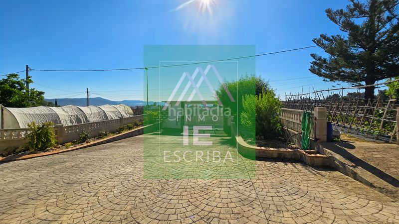 Foto c65fc524-cedd-4f8c-838d-fb92fecf88e6. Xalet amb xemeneia calefacció aparcament piscina a Catadau
