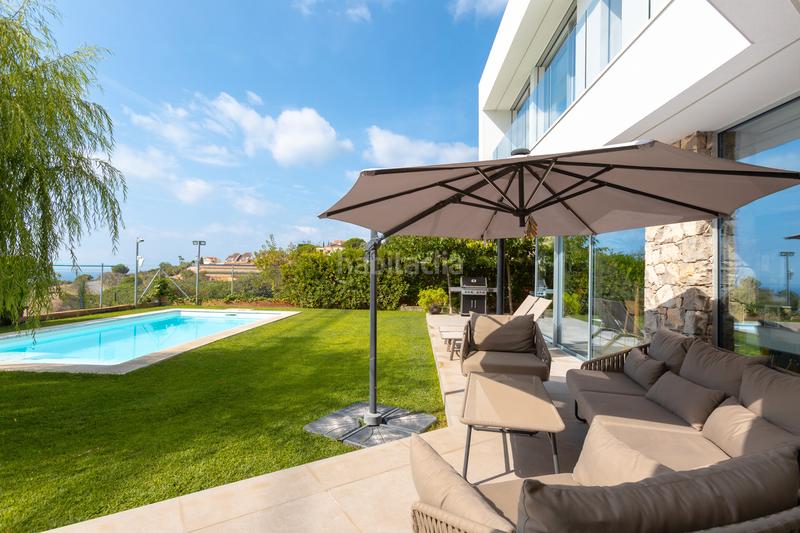 Foto a4ca6636-ba21-4d22-96fd-0493e7c0d551. Maison avec cheminée chauffage parking piscine dans Teià