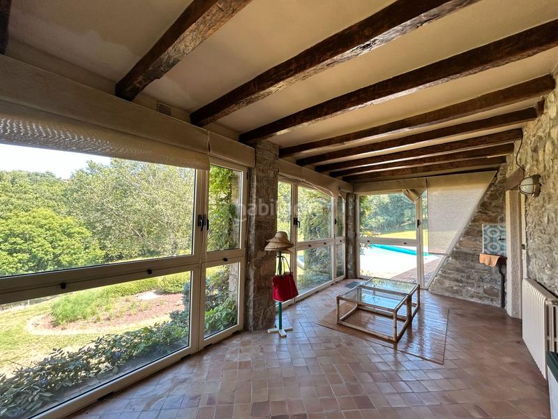 Foto f4ef7434-6ae3-4a3a-a637-ee406f78d261. Casa con camino riscaldamento parcheggio piscina in Sant Joan les Fonts