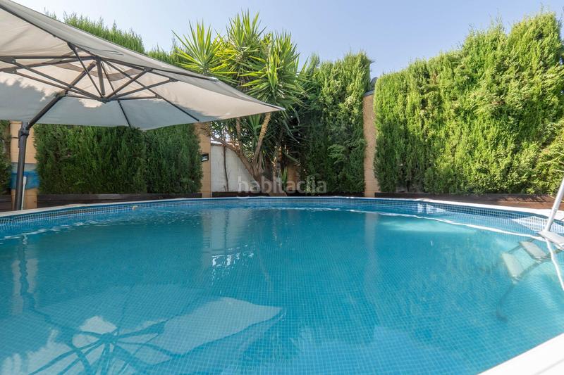 Foto 662130aa-737c-48a3-be18-5d95091a82c0. Casa aparellada amb calefacció aparcament piscina a Zubia (La)
