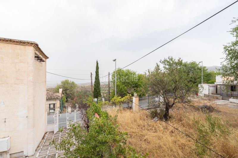Foto 1c7b33ad-59d6-40c9-87e5-573e9add55b0. Chalet en camino de la barrera (far) 58 en el Fargue 2000 metros de parcela segregable con chalet de 178m en tres plantas mas nave de 90 metros!!! en Granada