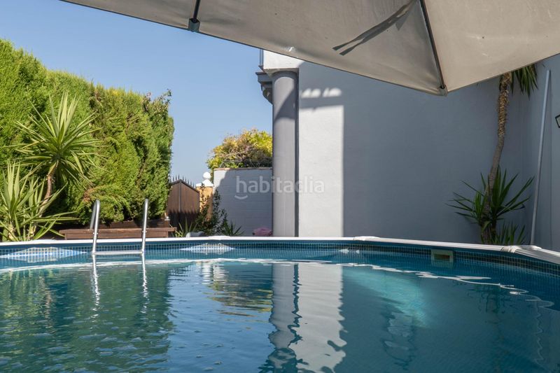 Foto 1f865178-a104-4959-a6d5-2938574e9199. Casa aparellada amb calefacció aparcament piscina a Zubia (La)