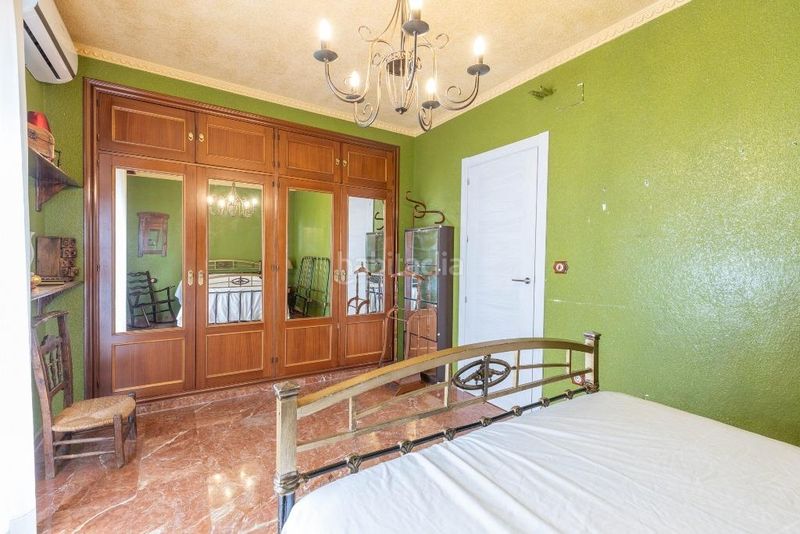 Foto e1e5fdb4-18fc-466d-88cf-58e81ca38486. Casa adossada a calle calle de averroes a Joaquina Eguaras Granada