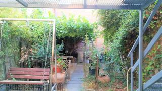 Casa adossada  Sant josep. Casa de pueblo con patio ajardinado
