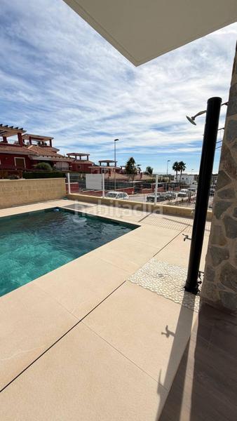 Foto 43329a75-0523-4b67-8c1d-68d3ecfc5549. Chalet with parking pool in balcón de Finestrat-terra marina Finestrat