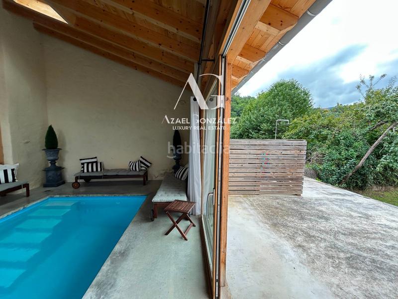 Foto 4cee7bbe-8323-45bd-9b02-d2fd610ddd5a. Casa adossada amb calefacció piscina a Molledo