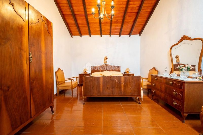 Foto ad6ca3a6-c0df-4cd2-b112-377fc744304d. Casa aparellada amb aparcament a Chío Guía de Isora