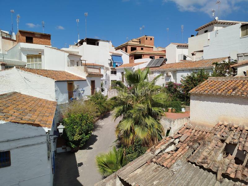 Foto f3bf8f0b-c697-49e8-858b-b86ed642462b. Casa adosada en Benamocarra